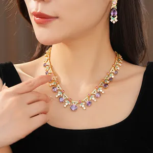 Exquisite palace style necklace and earring set with purple zircon stones on Asian model