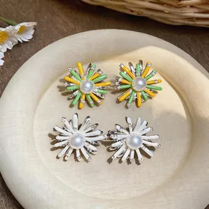 Elegant daisy pearl stud earrings in white and yellow-green floral designs for women