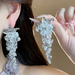 Exquisite glass bead flower tassel earrings shown with high-detail close-up view