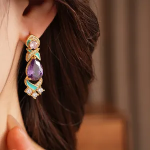 Elegant court-style earrings featuring purple teardrop zircon and light blue enamel details
