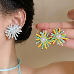 Detailed macro view of elegant flower pearl earrings with colorful petals and zircon accents