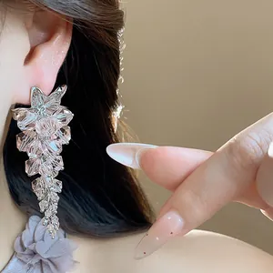 Close-up of elegant pink glass bead flower tassel earrings with shimmering faceted detail
