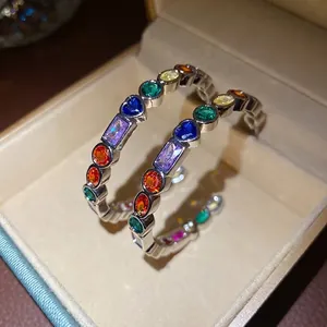 Rainbow zircon C-shaped hoop earrings with silver pins for a retro French look