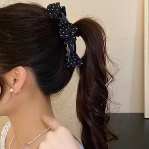 Black and white polka dot bow banana clip for women in sweet Korean hair style