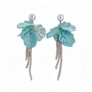 Elegant blue petal drop earrings with pearls and silver tassels for a vacation look.