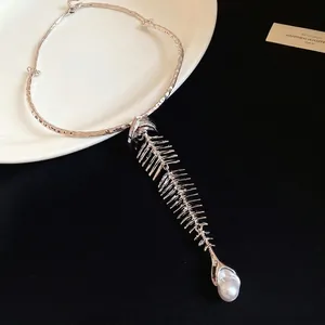 Statement vintage silver fishbone choker necklace with elegant pearl pendant detail