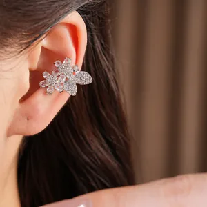 Detailed close-up of elegant flower and butterfly zircon ear cuff for non-pierced ears