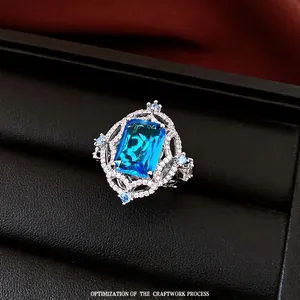 Vintage palace style open ring with rectangular blue zircon and white crystal accents