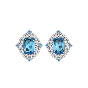 Vintage court style earrings featuring emerald-cut blue stones and sparkling zircon accents
