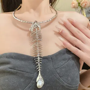 Detailed close-up of a vintage silver fishbone choker featuring a large pearl pendant