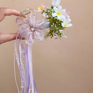 Elegant balletcore floral hair claw clip featuring long lavender ribbons and rhinestone