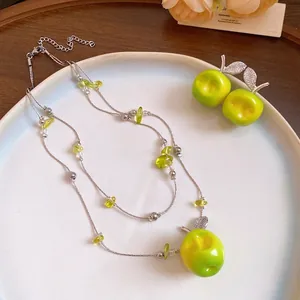 Green resin apple jewelry set with double-layered beaded necklace and zircon earrings