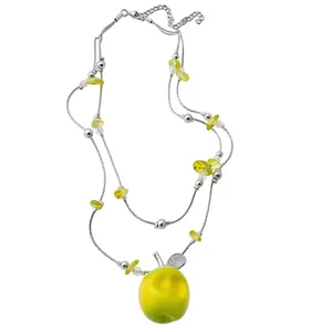Double-layer beaded necklace featuring a vibrant yellow resin apple pendant on white