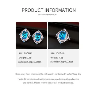 Close-up of vintage blue zircon jewelry set including square ring and stud earrings