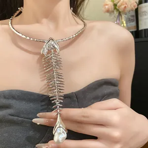 Detail view of a vintage oversized fishbone choker necklace with pearl pendant on model