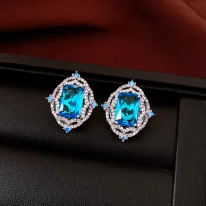 Detailed view of luxury vintage earrings featuring large rectangular blue zircon stones