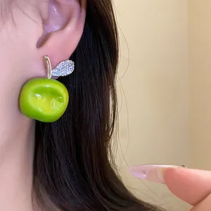 Delicate green resin apple earrings with a sparkling zircon leaf detail for women