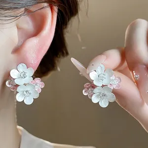 Elegant white and pink enamel flower stud earrings with sparkling zircon center details