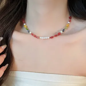 Elegant close-up of a colorful beaded stone and pearl necklace on a woman's neck for a trendy look