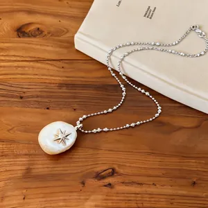 Elegant ins style cotton pearl necklace featuring a silver star pendant on a bead chain