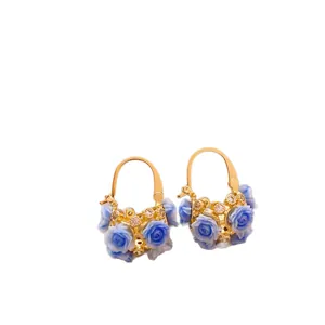 Elegant gold basket-shaped hoop earrings decorated with charming miniature blue roses