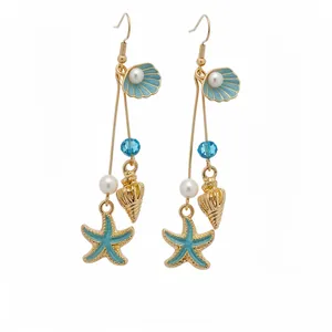 Elegant holiday style starfish and seashell drop earrings featuring pearls and blue glass beads