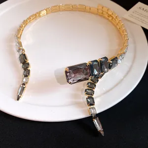 Detailed view of the vintage gold choker featuring square grey and clear crystals
