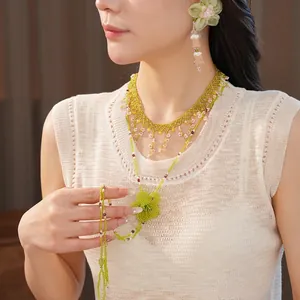 Elegant forest style green beaded flower necklace and earring set for summer vacation