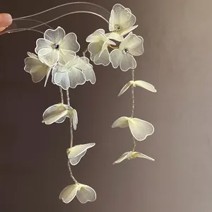 Elegant handmade mesh flower tassel earrings with rhinestones for a vintage vacation style