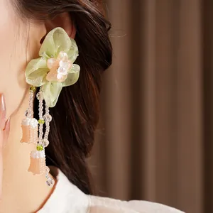 Elegant green chiffon flower earring with delicate resin petals and beaded tassels