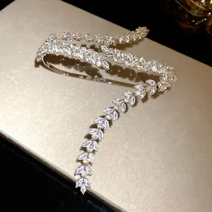 Close-up detail of elegant wheat ear-inspired bracelet with shimmering marquise zircon stones.