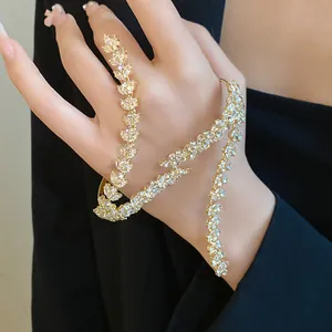 Exquisite gold wheat ear hand chain bracelet with marquise-cut zircons and unique design.