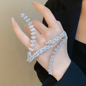 Close-up of elegant wheat-ear shaped zircon hand chain on model's hand