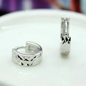 Elegant 925 sterling silver hoop earrings with diamond-cut pattern for women, minimalist style.