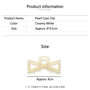 Close-up of elegant creamy white pearl hair claw clip showing the precise size details