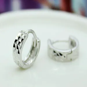 Elegant 925 sterling silver hoop earrings with a minimalist diamond-cut carved pattern.