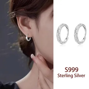 Detailed shot of S999 sterling silver hoop earrings featuring a zircon pavé design.
