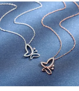 Detail shot of s925 sterling silver butterfly necklaces in silver and rose gold tones