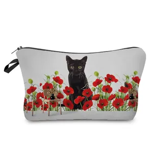 Artistic toiletry bag featuring a black cat print among vibrant red poppy flowers