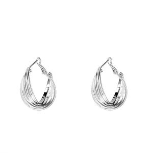 Elegant silver multi-layer twisted hoop earrings with a minimalist polished metal finish