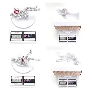 Detailed views showing the weight and packaging of the reading woman resin ornament
