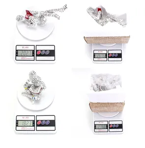 Detailed weight measurements of the reading woman resin figurine and its packaging.
