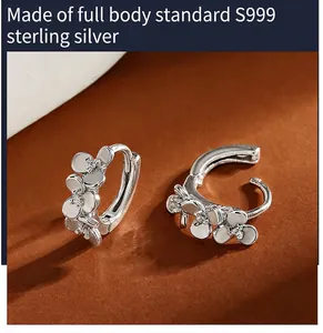 Macro view of S999 sterling silver flower earrings featuring shimmering zircon accents