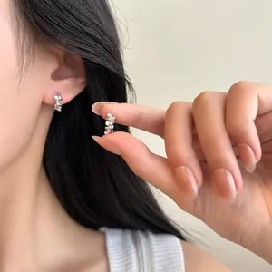 Minimalist S999 sterling silver flower earrings with zircon inlay for a delicate look