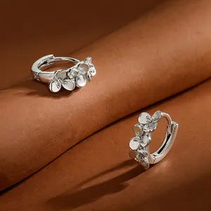 Elegant S999 sterling silver flower hoop earrings with sparkling zircons for women