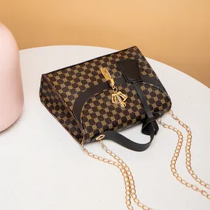 Stylish monogram printed shoulder bag with elegant gold chain and crown charm