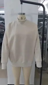 Detailed front view of a women's beige mock neck fleece sweatshirt on a mannequin