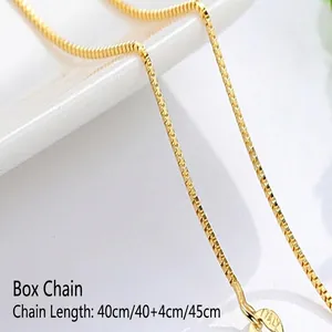 Detailed close-up showing the smooth texture of a golden box chain necklace links