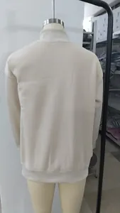 Detailed back view of a minimalist cream fleece-lined half-turtleneck sweatshirt for women