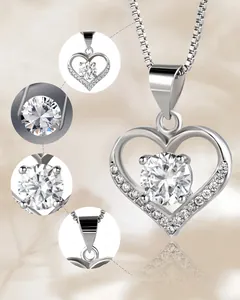 Detailed macro view of S925 sterling silver heart pendant with shimmering cubic zirconia stones.